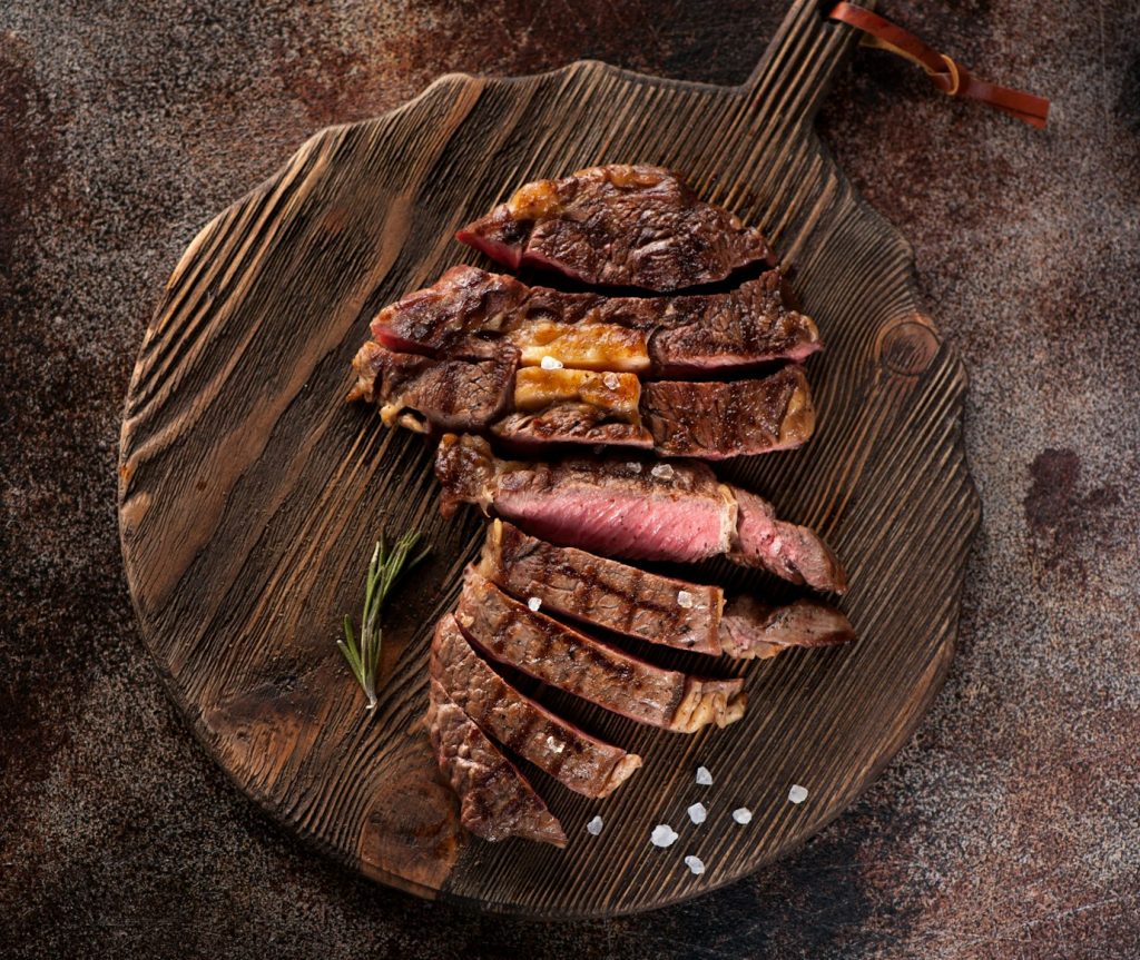 Sliced medium rare grilled beef steak ribeye